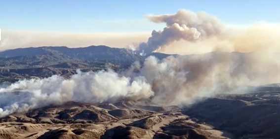 Winds blowing over the mountains in Los Angeles during the wildfire crisis, influencing fire behavior and containment efforts.