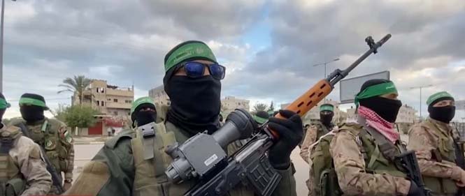 Portrait of Hamas fighters in Gaza displaying determined expressions and militant resolve amid escalating regional conflict.