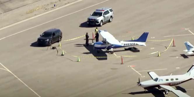 Aerial view of the Marana Airport crash site in Arizona, showing the wreckage from a tragic midair collision that claimed two lives, highlighting aviation safety concerns.