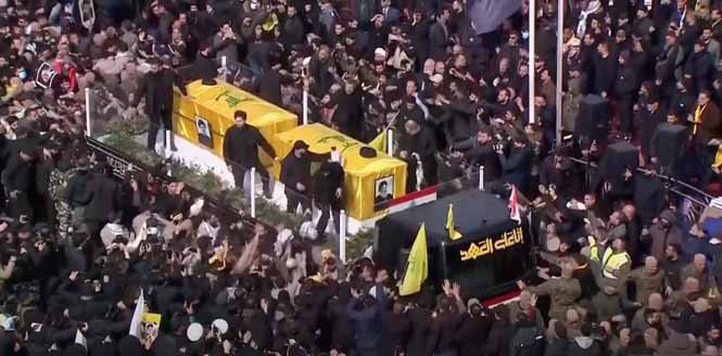 Funeral procession of Hezbollah leader Hassan Nasrallah, featuring his coffin carried by mourners in Beirut.