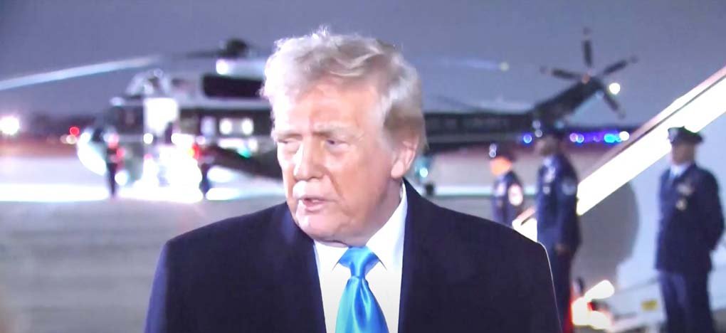 U.S. President Donald Trump signing an executive order freezing foreign aid, impacting global humanitarian efforts and strengthening authoritarian regimes.