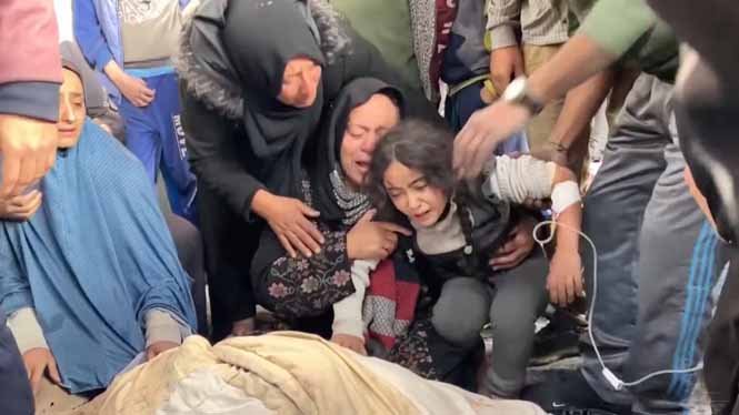Grieving civilians mourn loved ones killed in Israeli airstrikes, showing emotional devastation and loss.