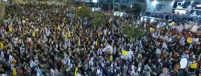Protesters gather in Tel Aviv for a mass rally, voicing their concerns amid rising tensions in Israel.